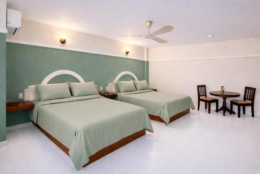 Double Room with Two Double Beds at Blue Pacific Suites, photo 2