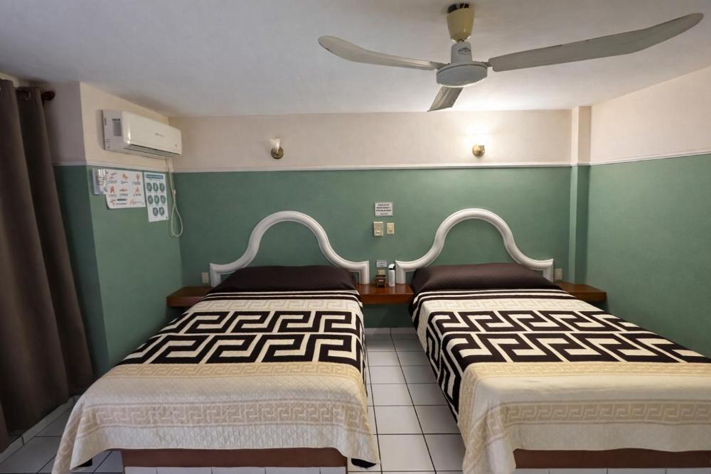 Double Room with Two Double Beds at Blue Pacific Suites, photo 3