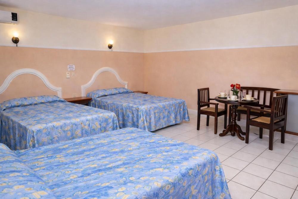 Budget Triple Room at Blue Pacific Suites, photo 2
